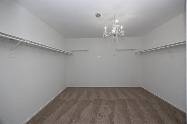 a view of a chandelier in an empty room