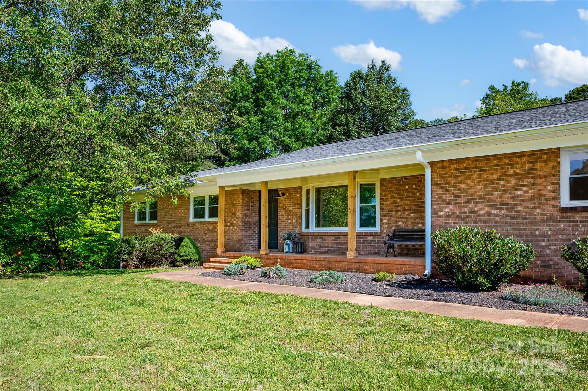 326 Gilbert Road Statesville, NC 28677 - Photo 1 of 25 a backyard of a house with outdoor seating