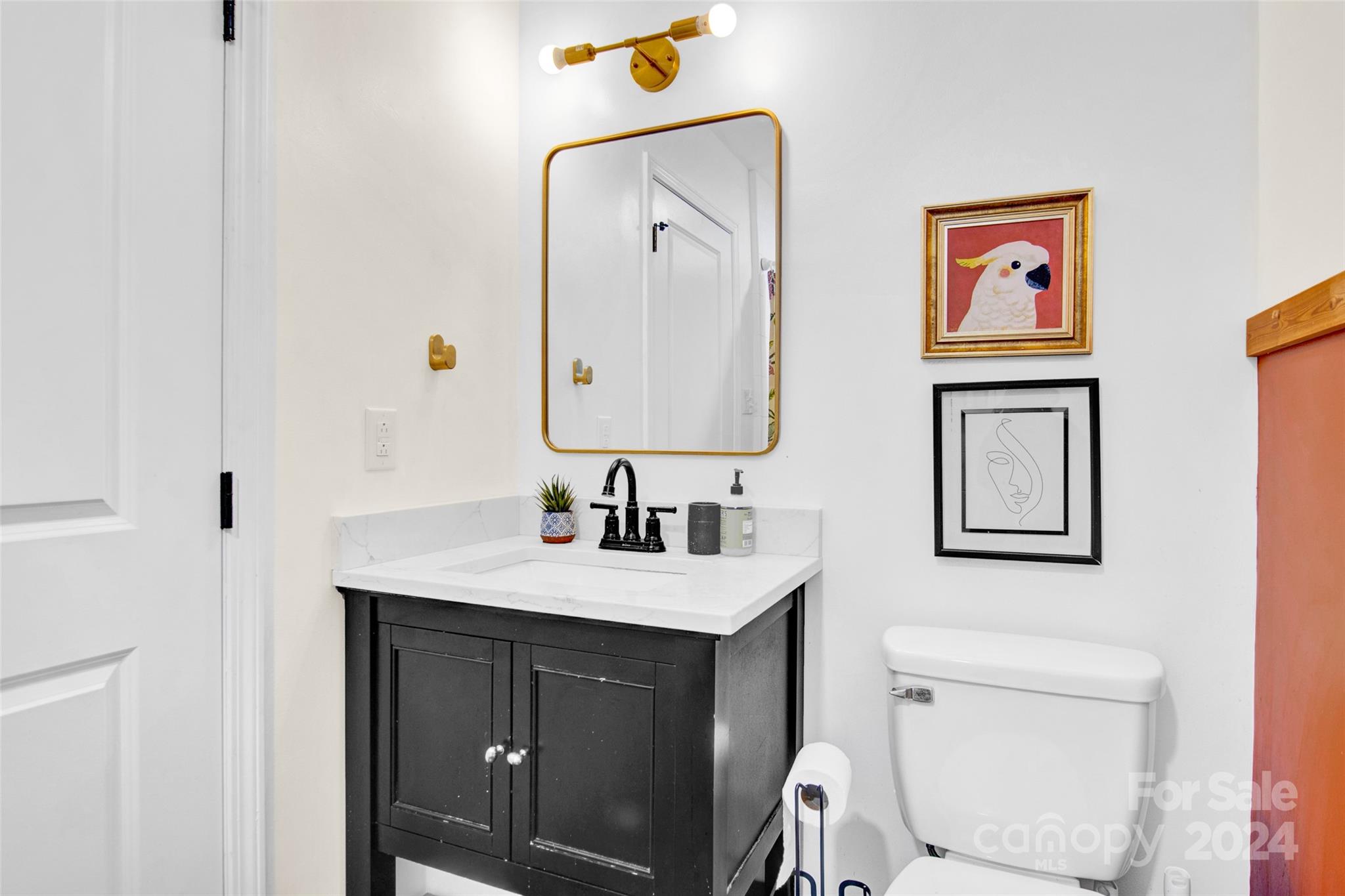 326 Gilbert Road Statesville, NC 28677 - Photo 13 of 25 a bathroom with a toilet a sink and mirror