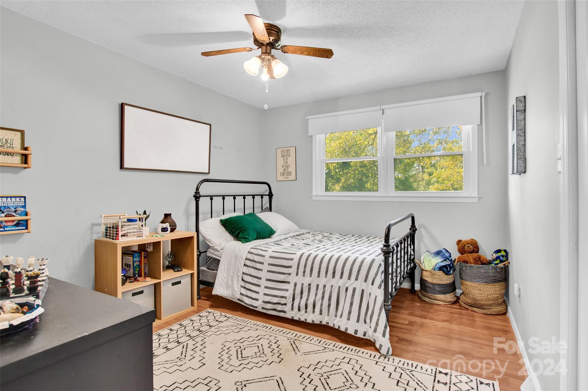 326 Gilbert Road Statesville, NC 28677 - Photo 14 of 25 a bedroom with a bed and a chandelier