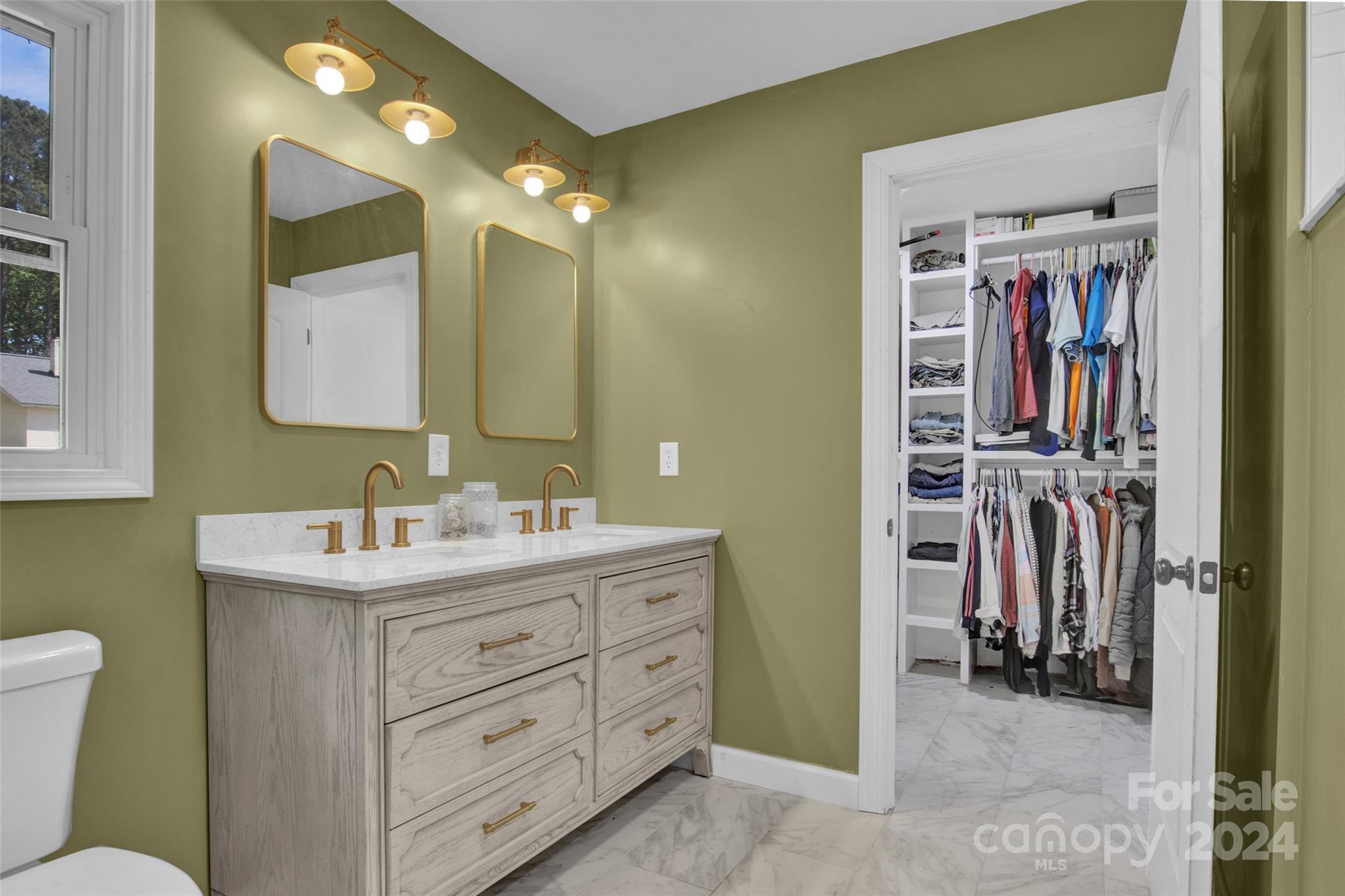326 Gilbert Road Statesville, NC 28677 - Photo 17 of 25 a bathroom with a sink a toilet and a mirror