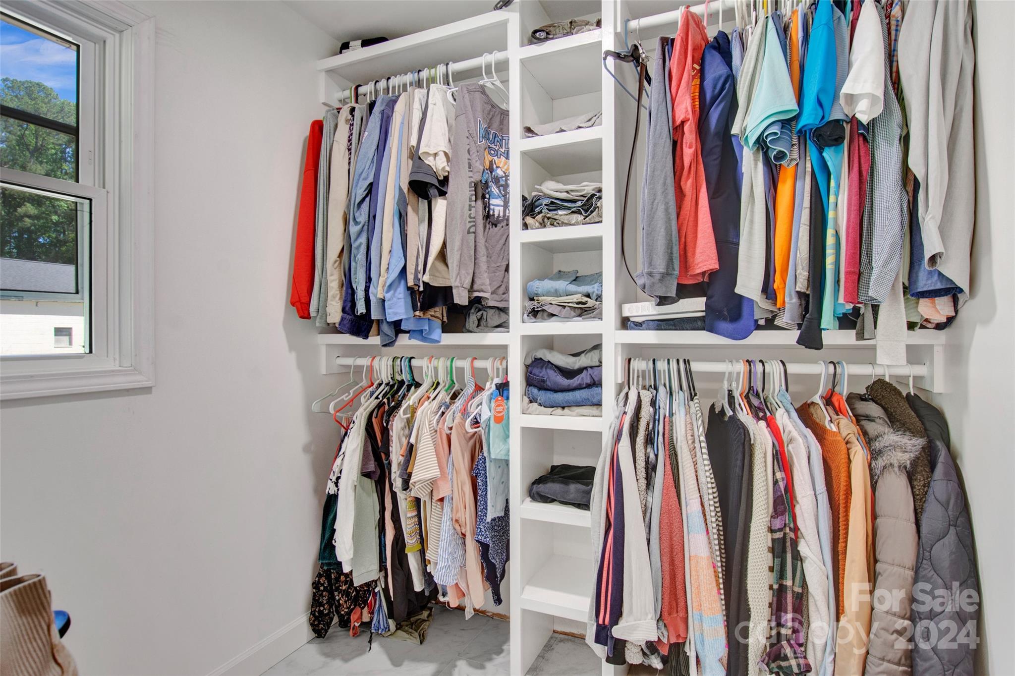 326 Gilbert Road Statesville, NC 28677 - Photo 19 of 25 a view of walk in closet with clothes
