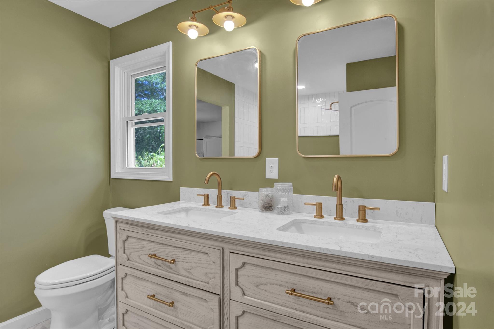 326 Gilbert Road Statesville, NC 28677 - Photo 20 of 25 a bathroom with a granite countertop toilet sink and mirror