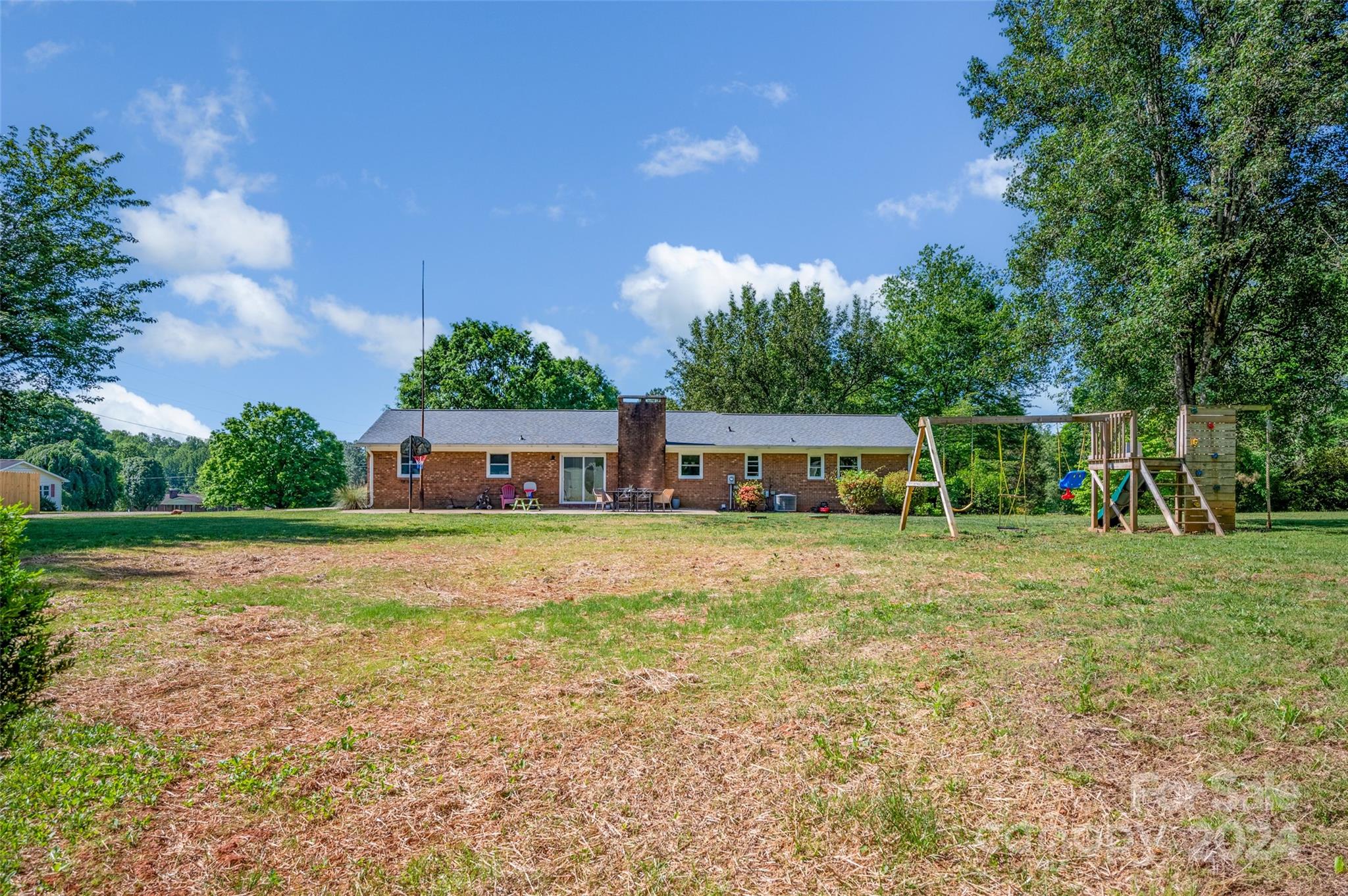 326 Gilbert Road Statesville, NC 28677 - Photo 23 of 25 a front view of a house with a yard and swimming pool