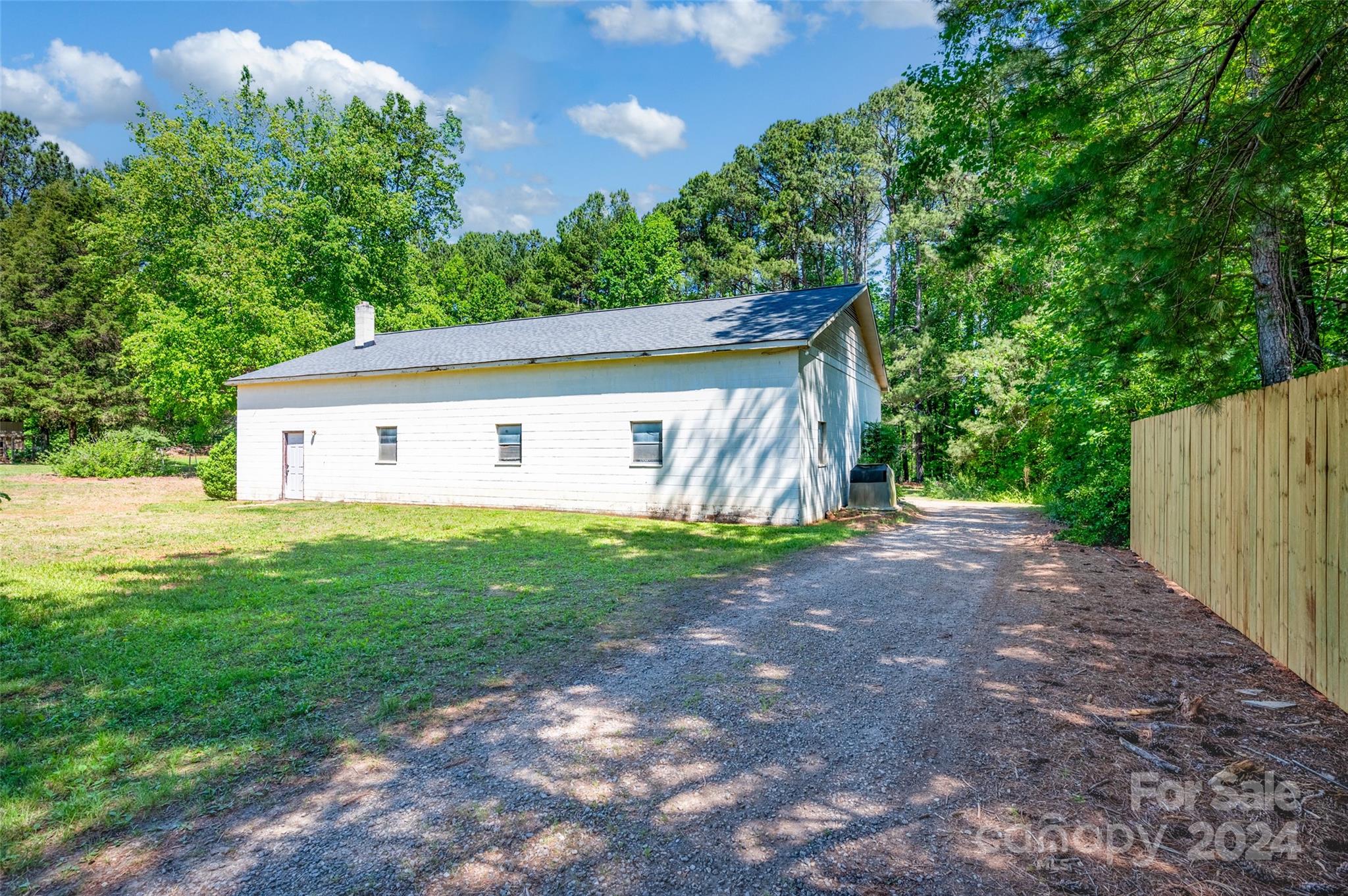 326 Gilbert Road Statesville, NC 28677 - Photo 6 of 25 a view of a house with backyard and garden