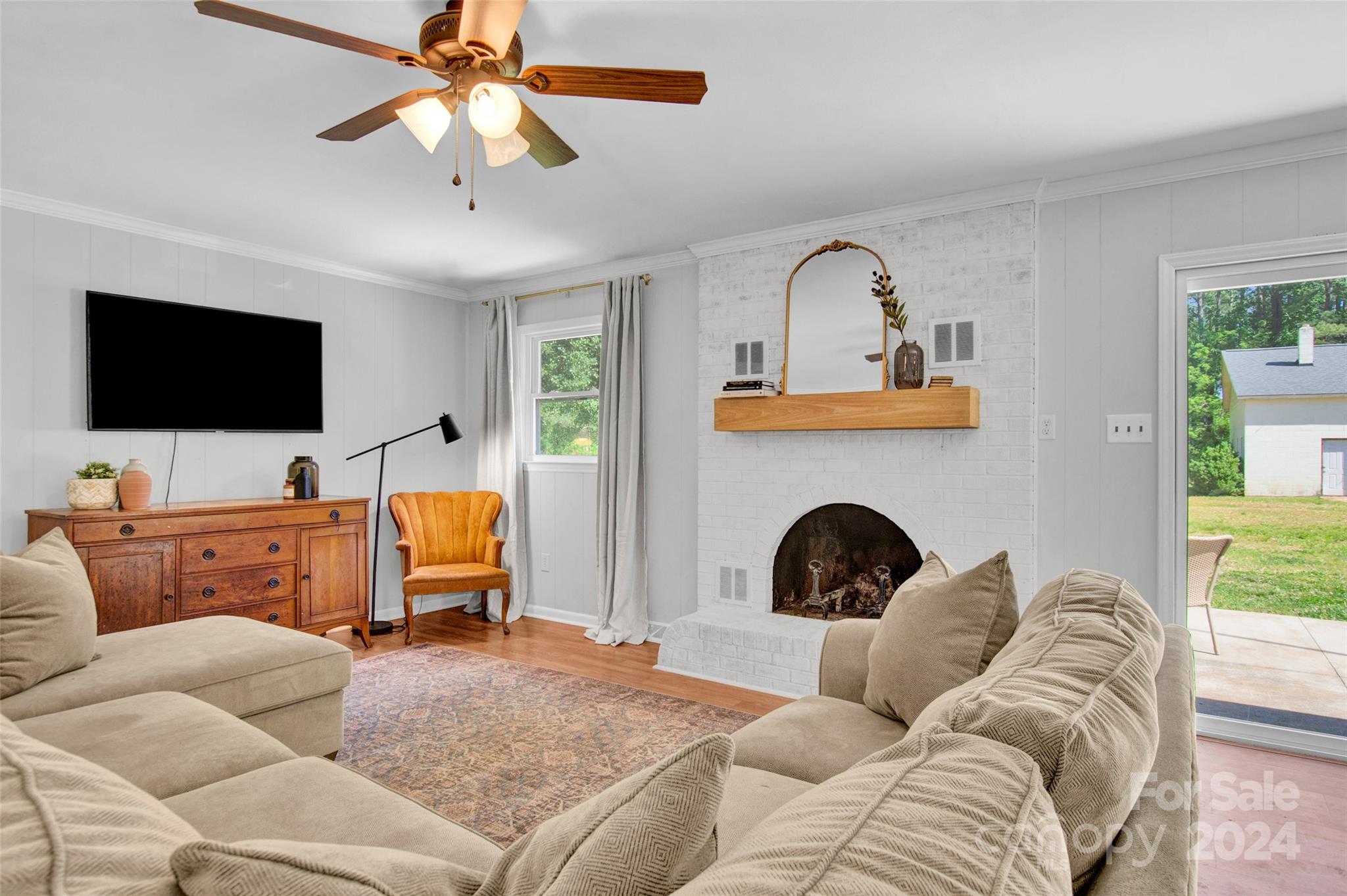 326 Gilbert Road Statesville, NC 28677 - Photo 8 of 25 a living room with furniture and a fireplace