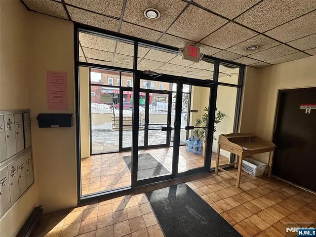 a view of a room with wooden floor and furniture