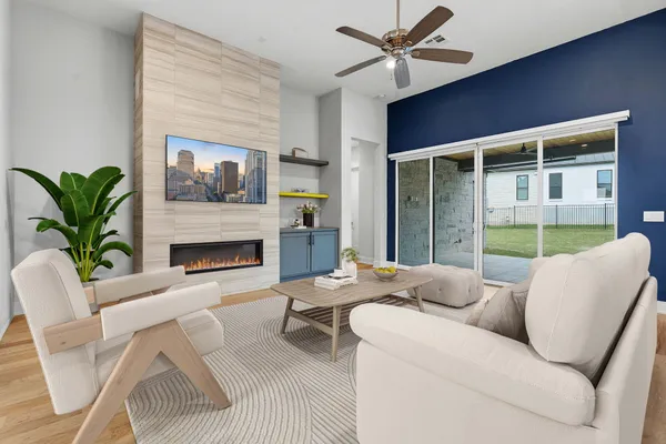 a living room with furniture and a fireplace