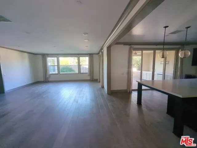 a view of a livingroom with furniture and window
