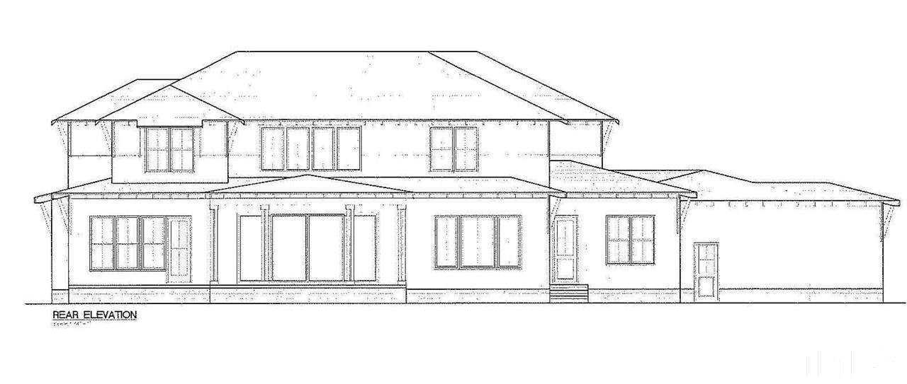 10336 Grafton Road Raleigh, NC 27615 - Photo 3 of 4 a white and white house with a large window