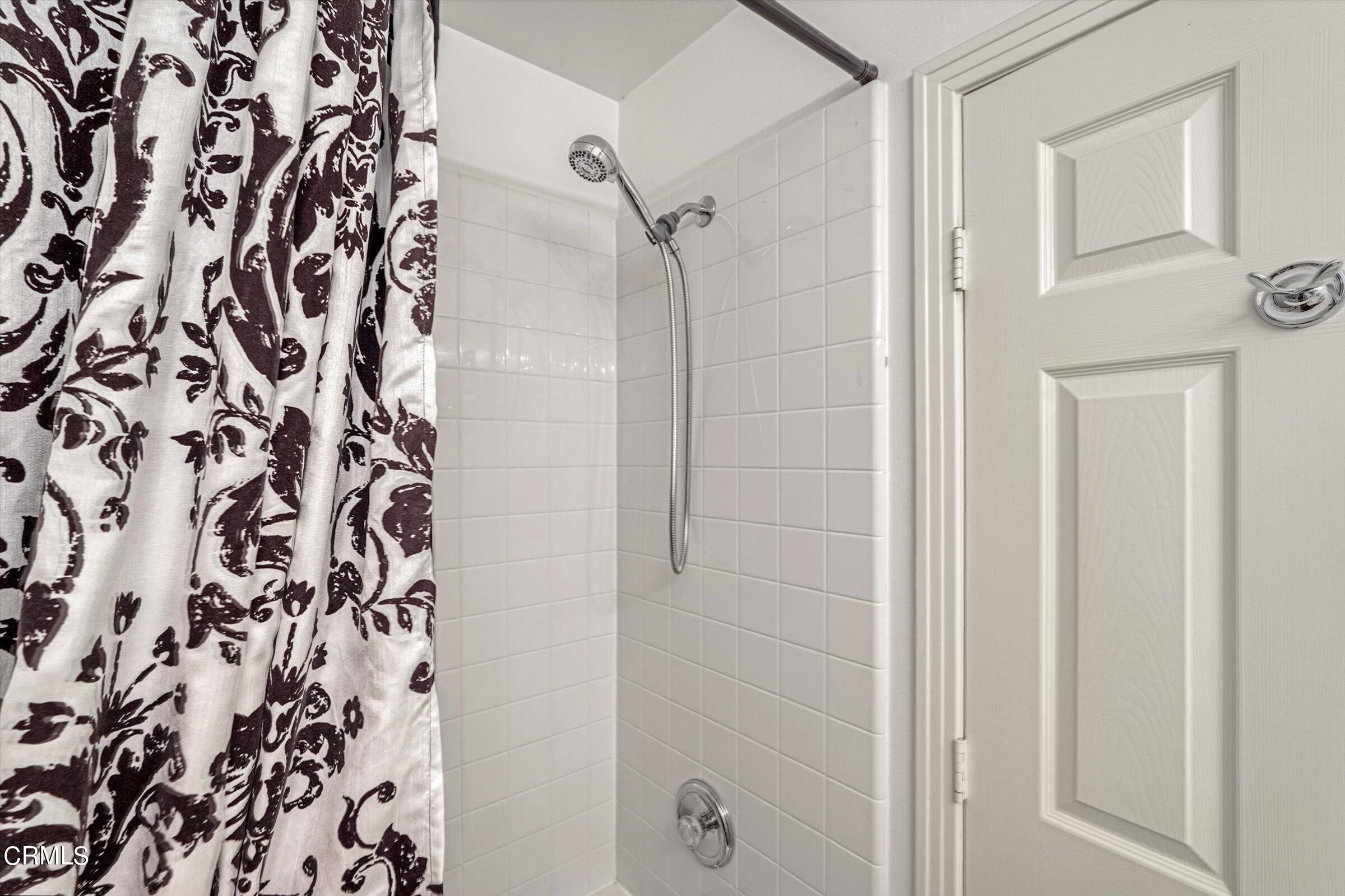 3315 Rising Star Avenue Simi Valley, CA 93063 - Photo 25 of 74 a bathroom with a shower curtain and a shower curtain
