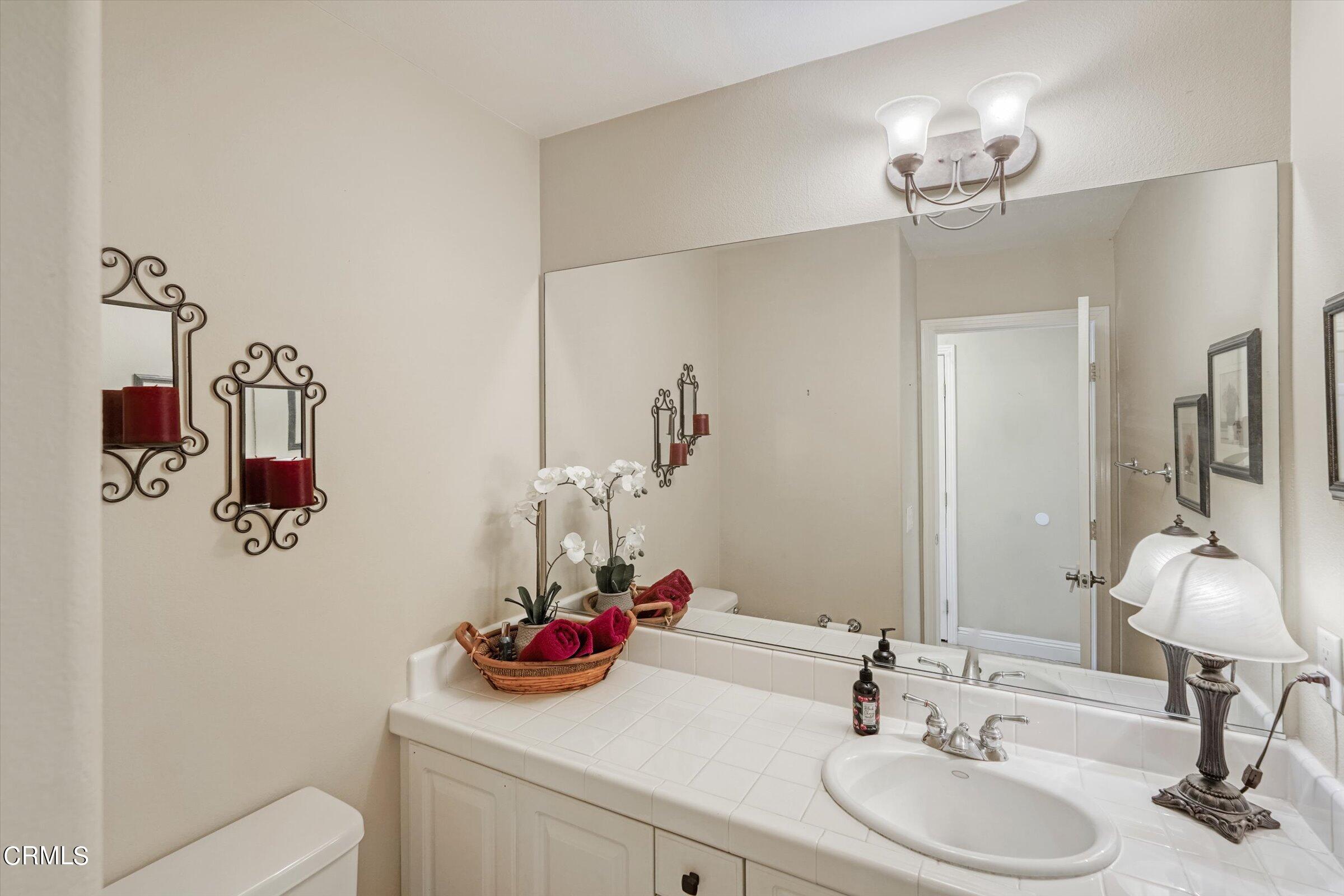 3315 Rising Star Avenue Simi Valley, CA 93063 - Photo 28 of 74 a bathroom with a sink and a mirror