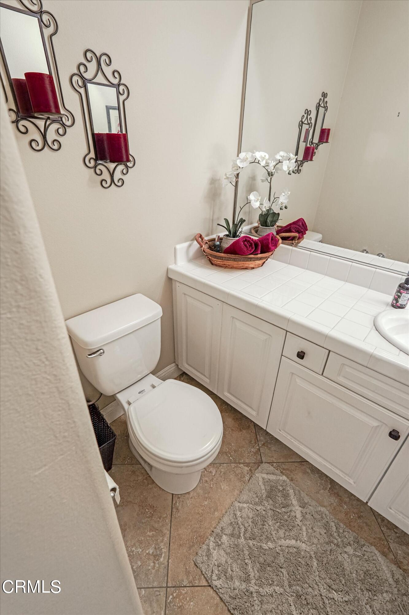 3315 Rising Star Avenue Simi Valley, CA 93063 - Photo 29 of 74 a bathroom with a toilet and a sink