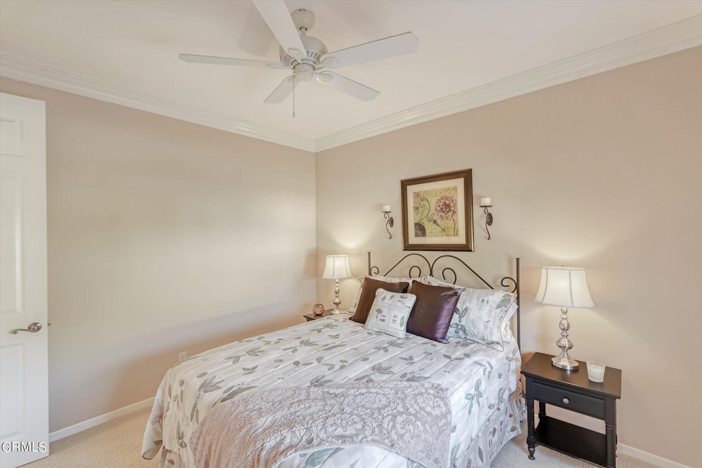 3315 Rising Star Avenue Simi Valley, CA 93063 - Photo 33 of 74 a bedroom with a bed and lamp on the dresser