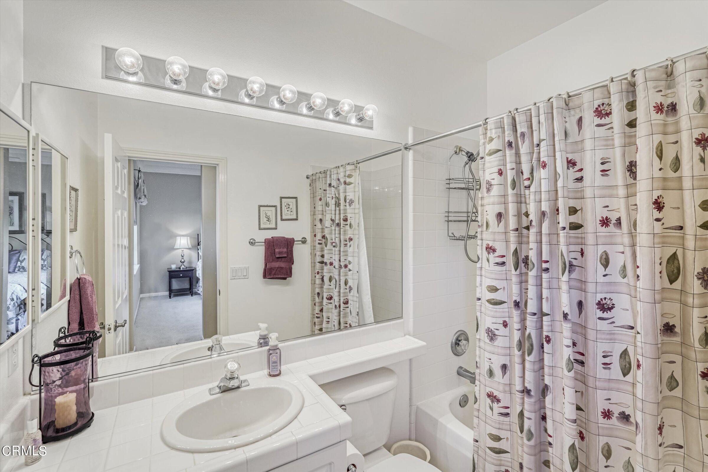 3315 Rising Star Avenue Simi Valley, CA 93063 - Photo 36 of 74 a bathroom with a double vanity sink mirror and shower