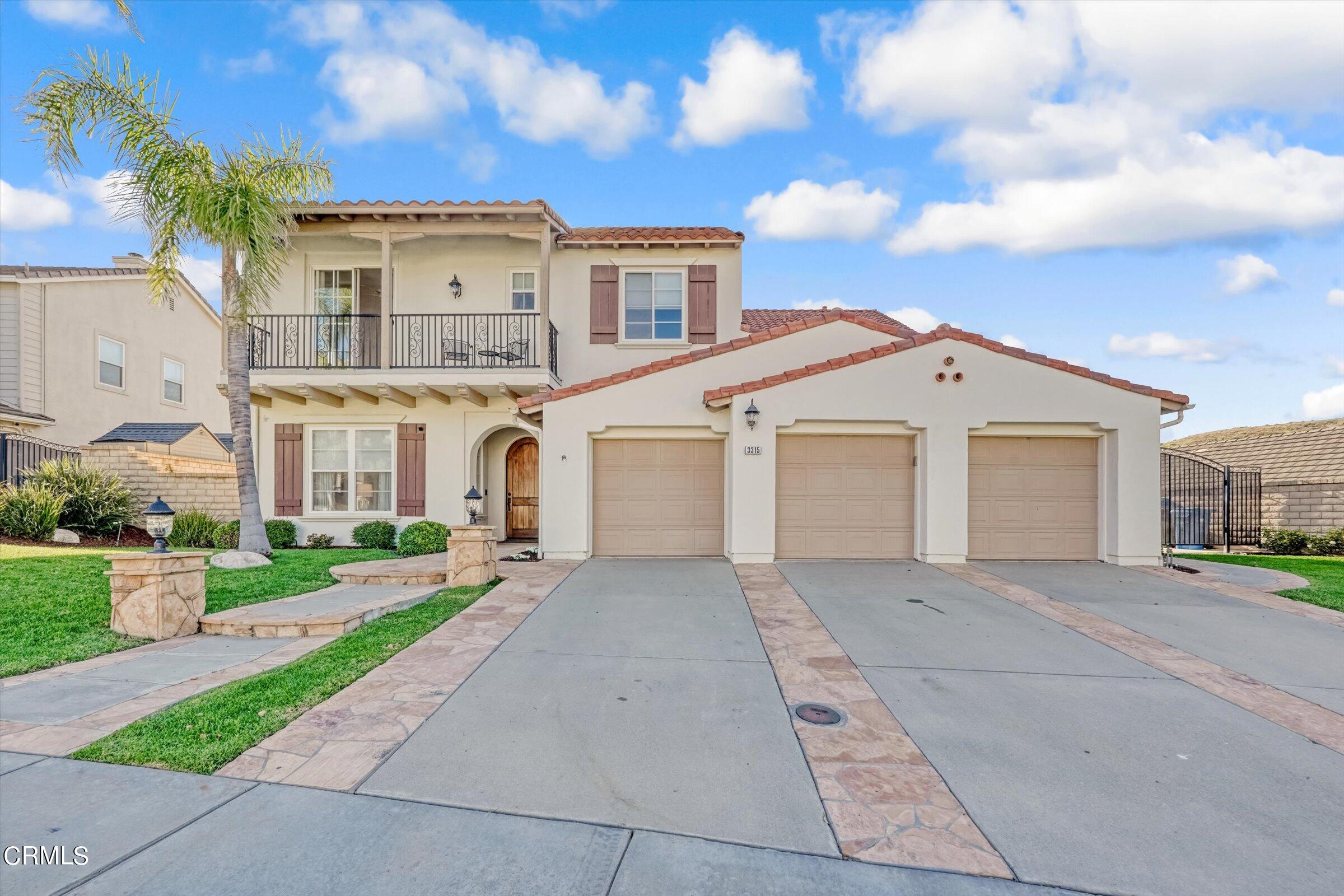 3315 Rising Star Avenue Simi Valley, CA 93063 - Photo 4 of 74 a front view of a house with a yard and garage