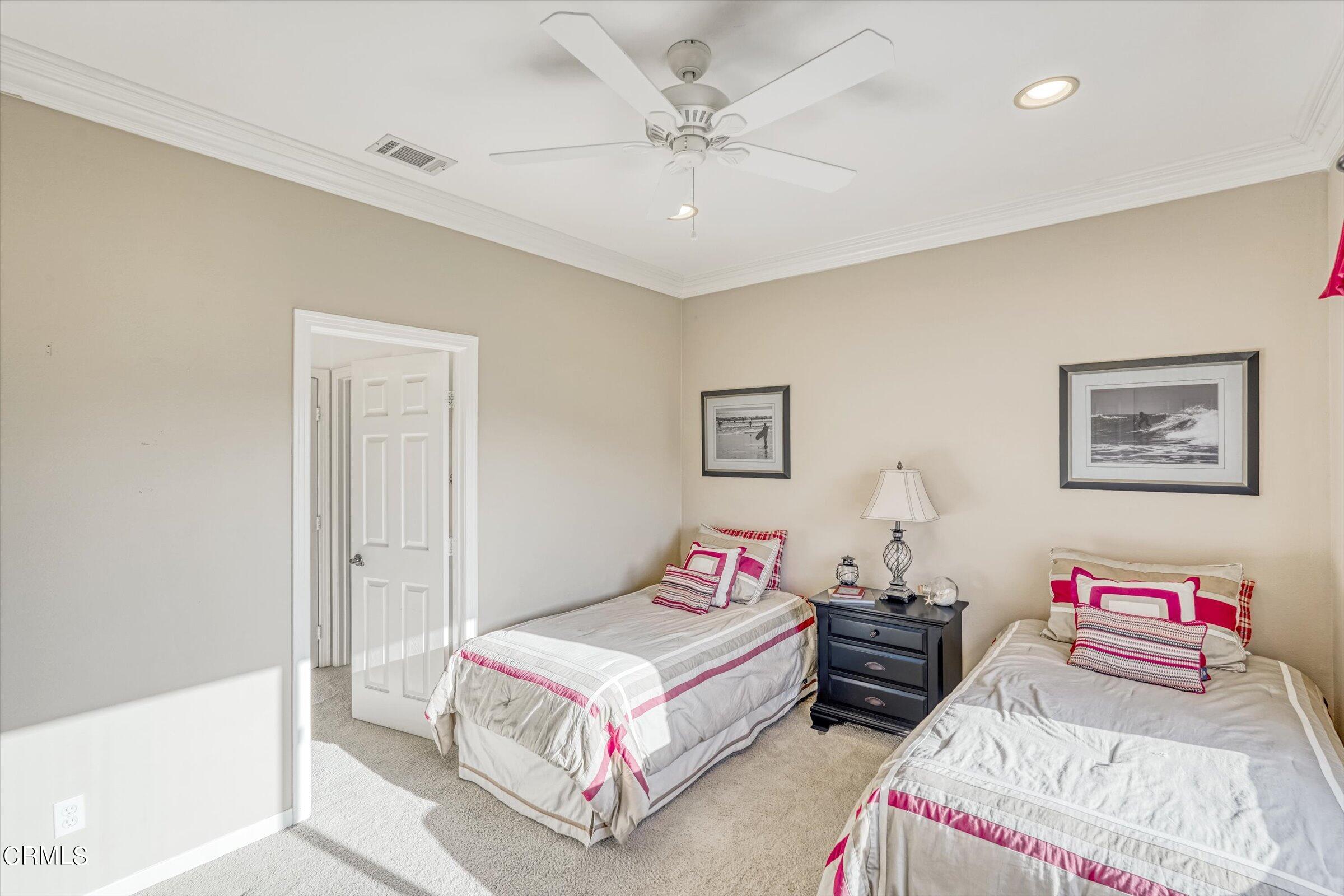 3315 Rising Star Avenue Simi Valley, CA 93063 - Photo 45 of 74 a bedroom with a bed and a chandelier