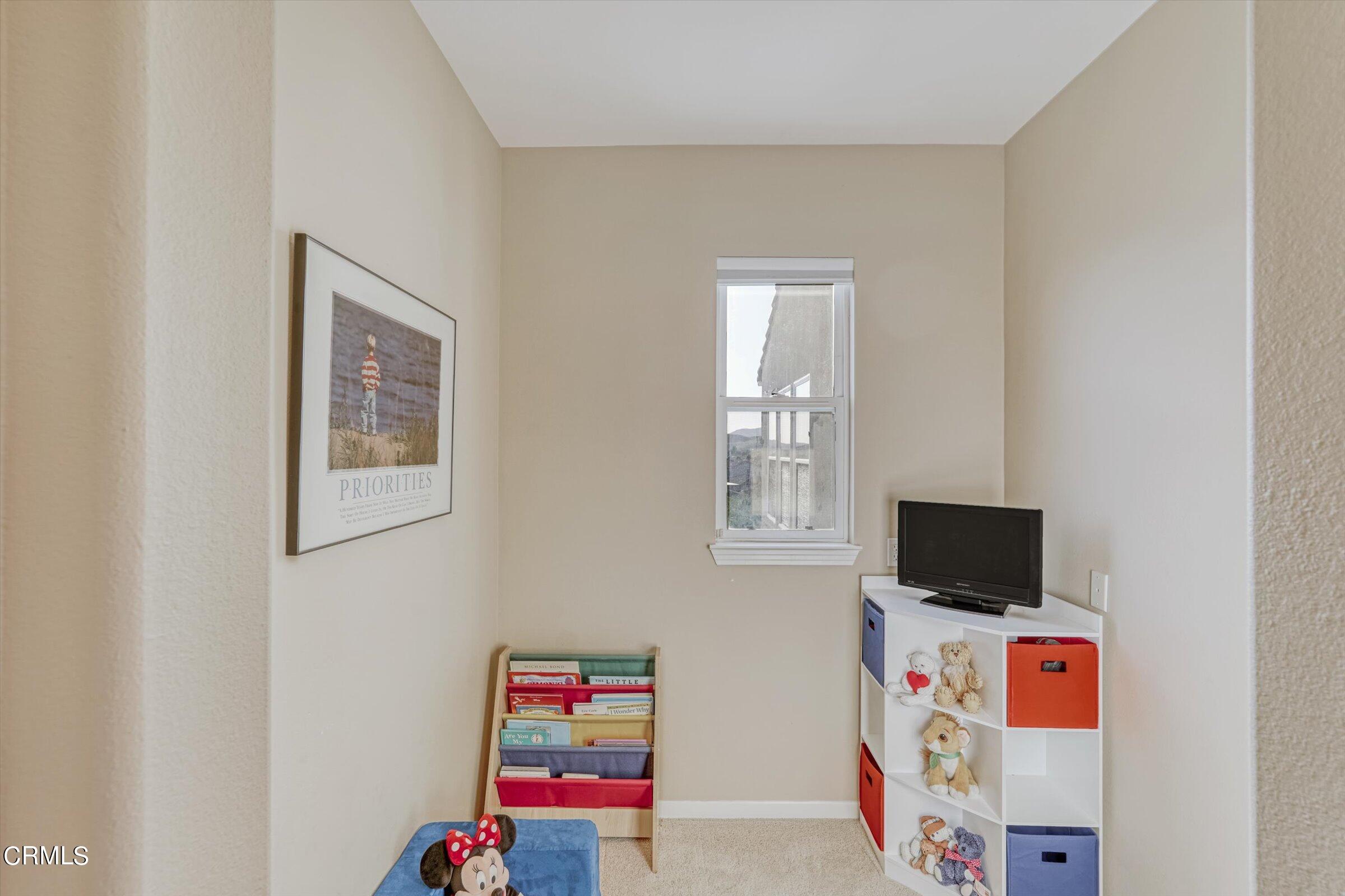 3315 Rising Star Avenue Simi Valley, CA 93063 - Photo 48 of 74 a living room with furniture and a flat screen tv