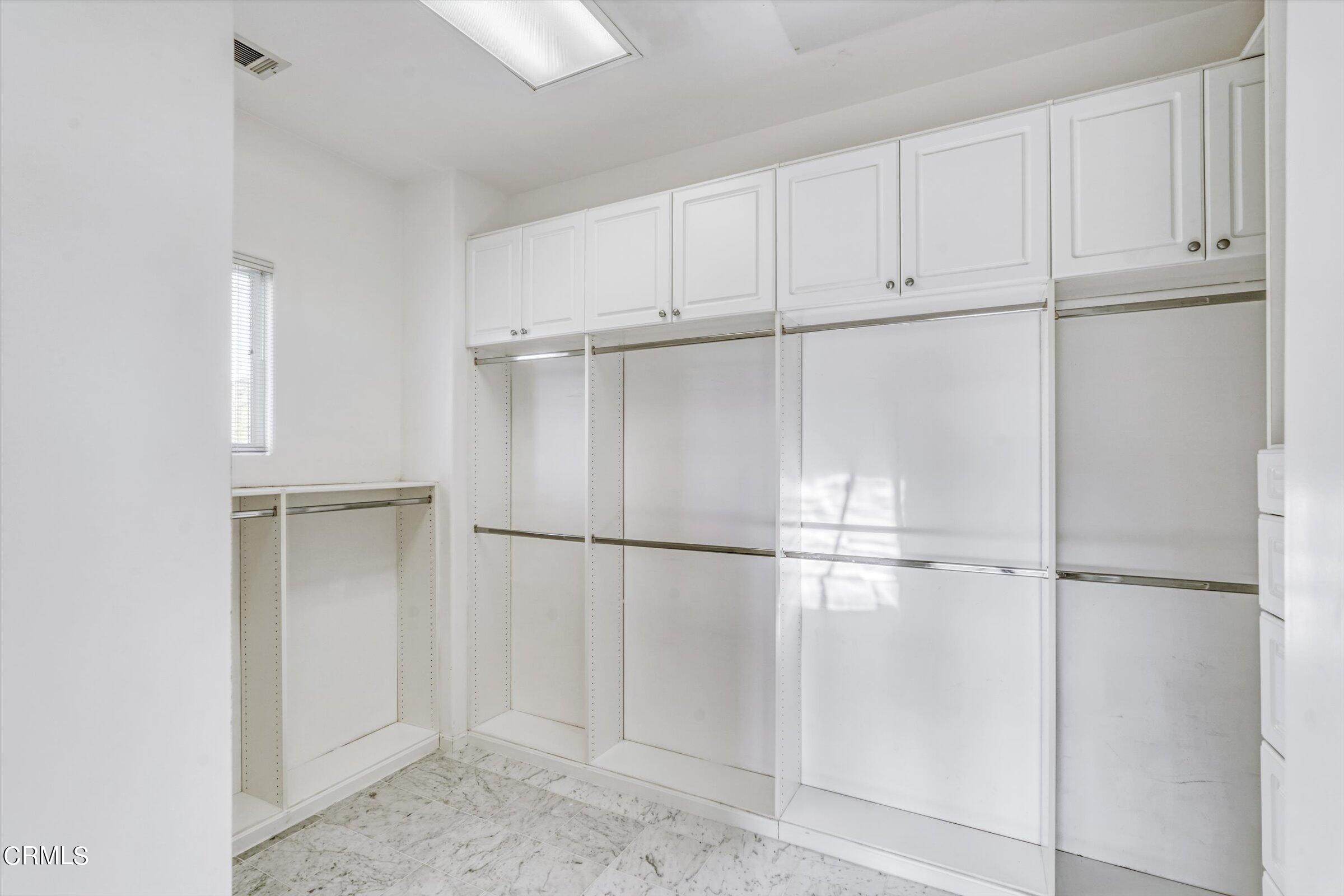 3315 Rising Star Avenue Simi Valley, CA 93063 - Photo 59 of 74 a white refrigerator freezer and a dishwasher in a kitchen