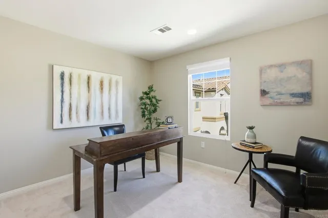 a workspace with furniture and window