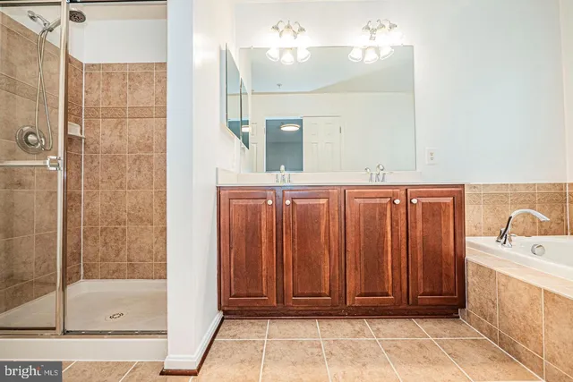 a bathroom with a tub and shower