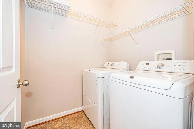 a front view of residential houses with yard