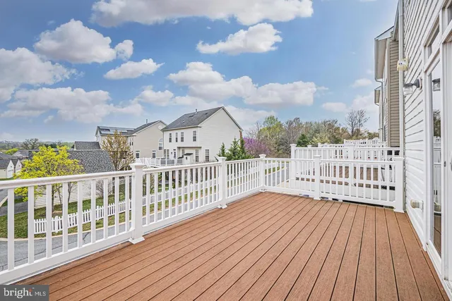 a view of a balcony with wooden fence