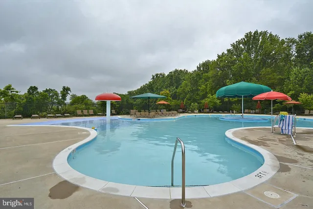 a front view of a house with yard and green space