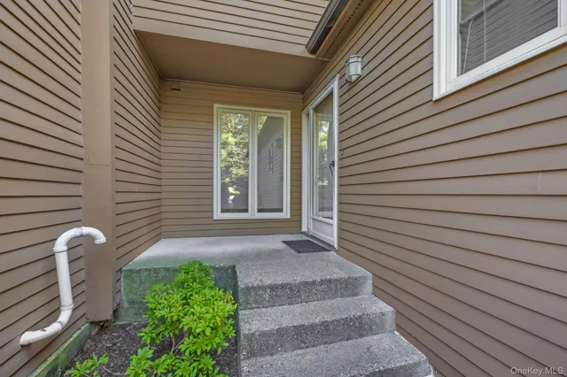 a view of a house with stairs and wooden floor