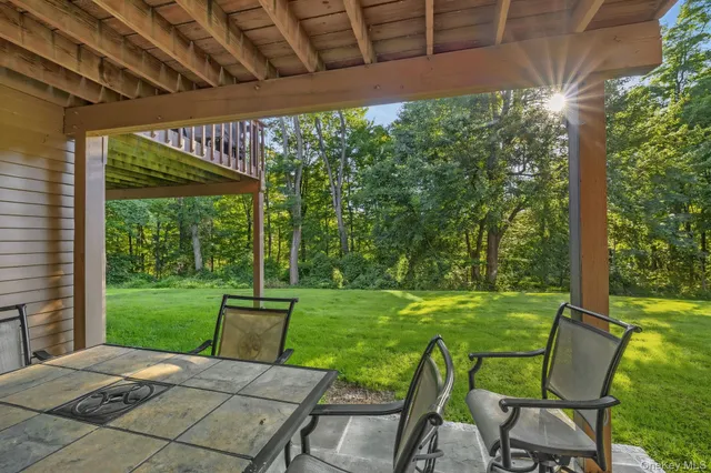 a view of a two chairs in the patio