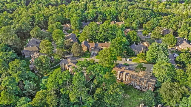 a backyard of a house with lots of green space and garden