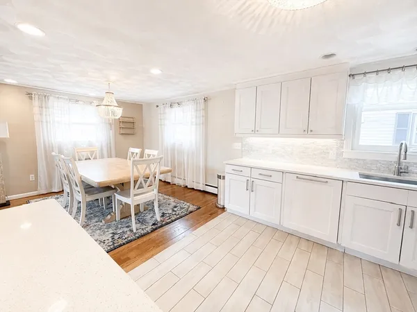 a kitchen with stainless steel appliances a refrigerator and a stove top oven