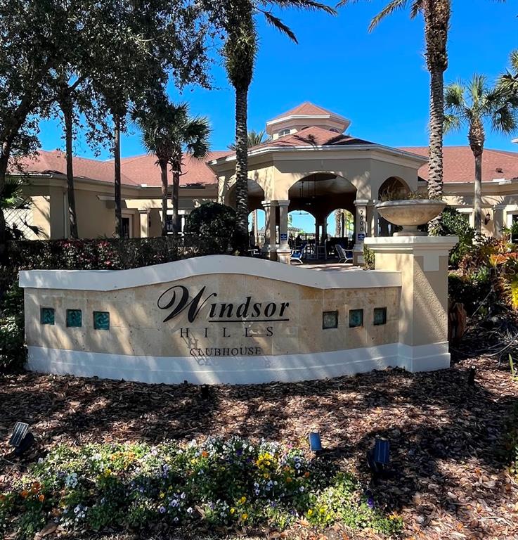 2534 Maneshaw Lane Kissimmee, FL 34747 - Photo 2 of 40 a front view of a building with trees