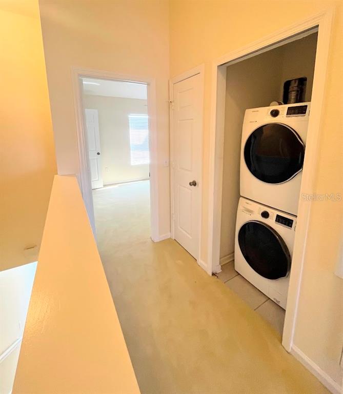 2534 Maneshaw Lane Kissimmee, FL 34747 - Photo 24 of 40 a view of a hallway with washer and dryer