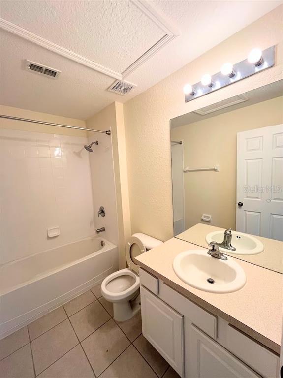 2534 Maneshaw Lane Kissimmee, FL 34747 - Photo 28 of 40 a bathroom with a sink a toilet and shower
