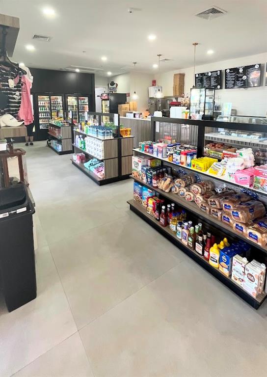 2534 Maneshaw Lane Kissimmee, FL 34747 - Photo 34 of 40 a living room with lots of furniture and toys