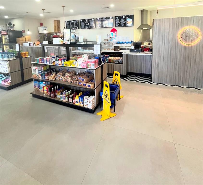 2534 Maneshaw Lane Kissimmee, FL 34747 - Photo 35 of 40 a room with stainless steel appliances lots of wooden furniture