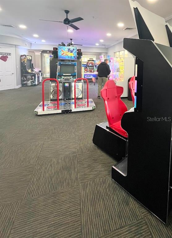 2534 Maneshaw Lane Kissimmee, FL 34747 - Photo 38 of 40 a room with lots of white furniture and chandelier