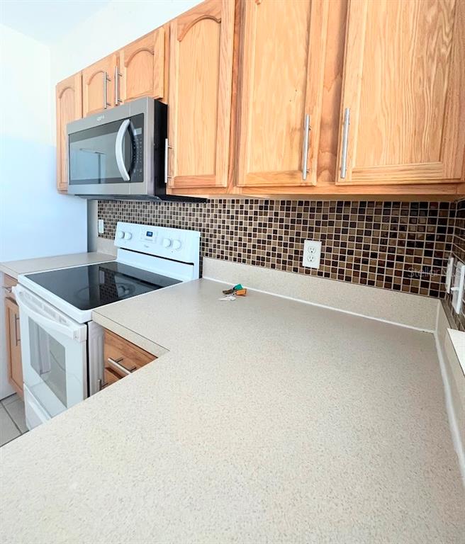 2534 Maneshaw Lane Kissimmee, FL 34747 - Photo 6 of 40 a kitchen with a sink and cabinets