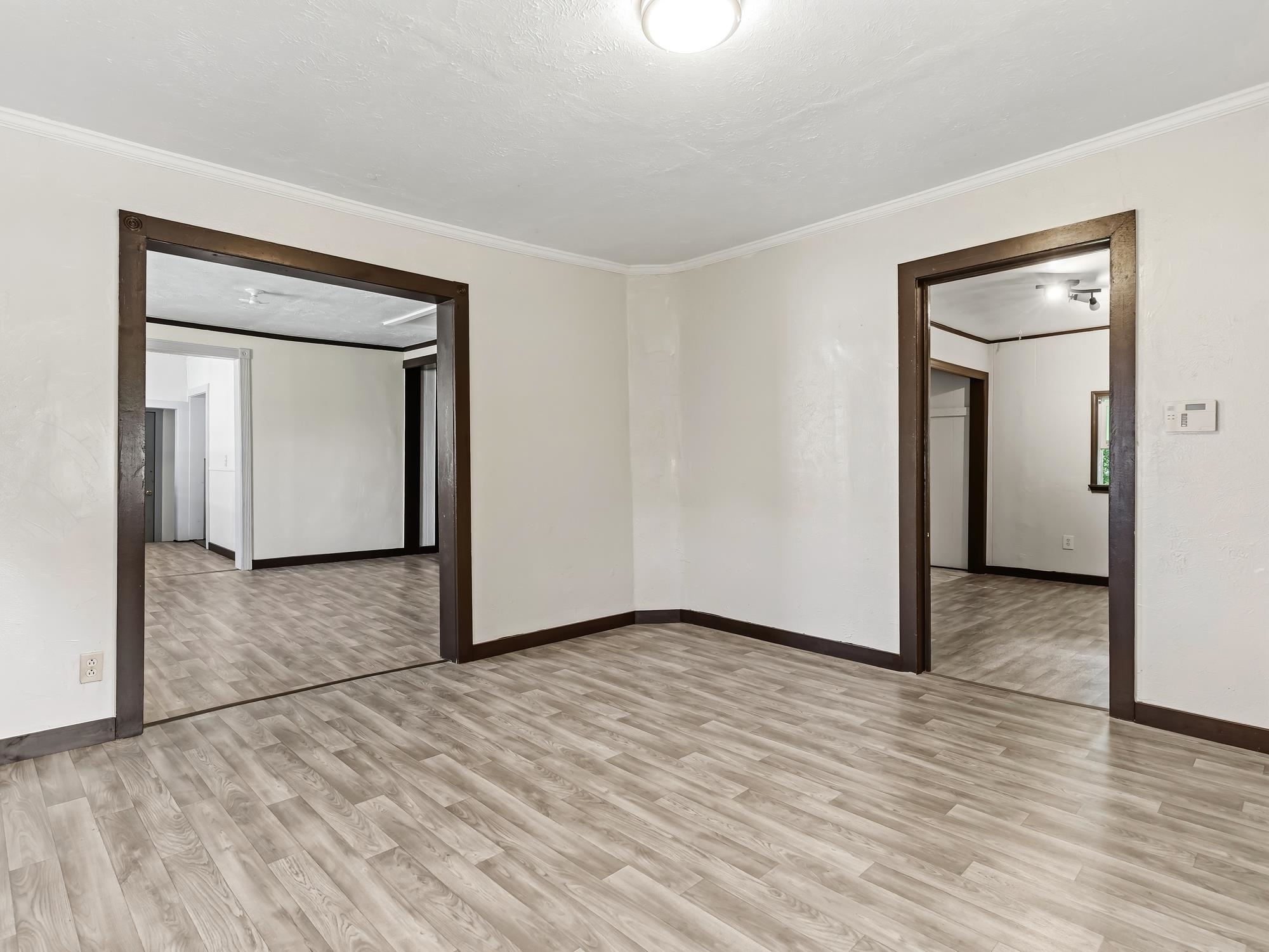 737 9th Street Port Arthur, TX 77640 - Photo 5 of 20 a view of an empty room with wooden floor and closet