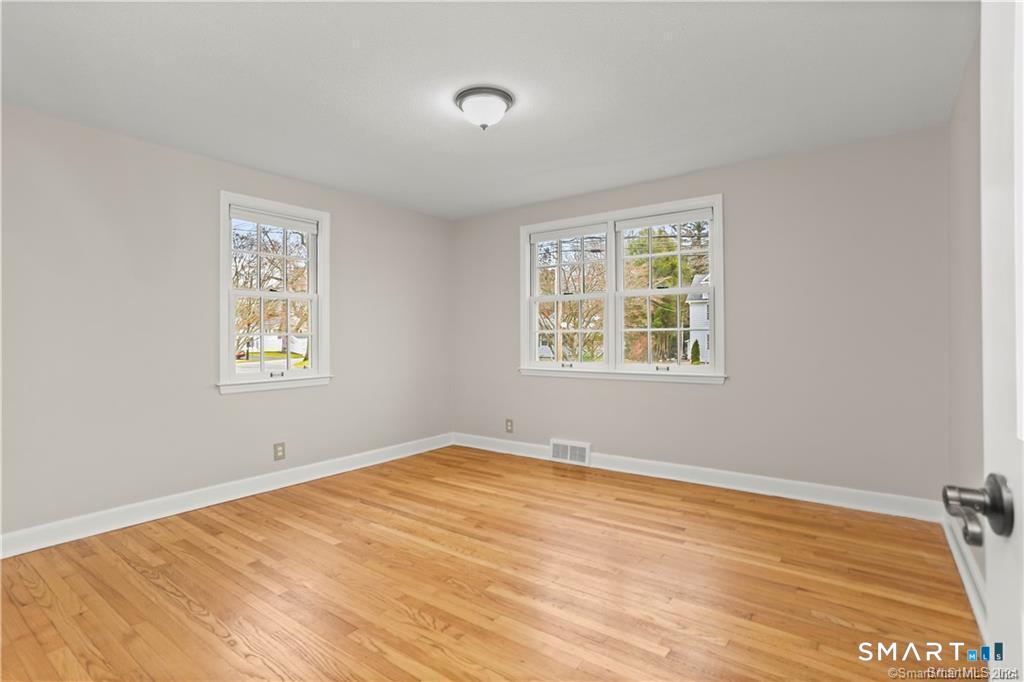 608 Stillson Road Fairfield, CT 06824 - Photo 6 of 16 a view of an empty room with a window