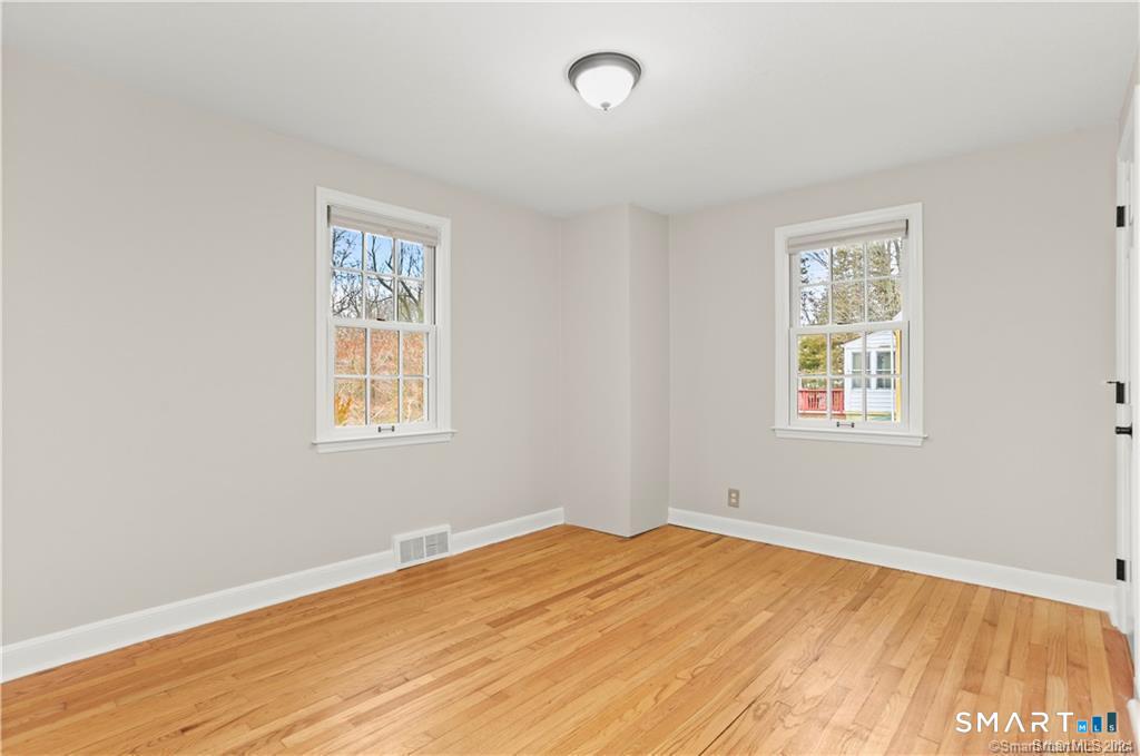 608 Stillson Road Fairfield, CT 06824 - Photo 7 of 16 a view of a room with wooden floor and window