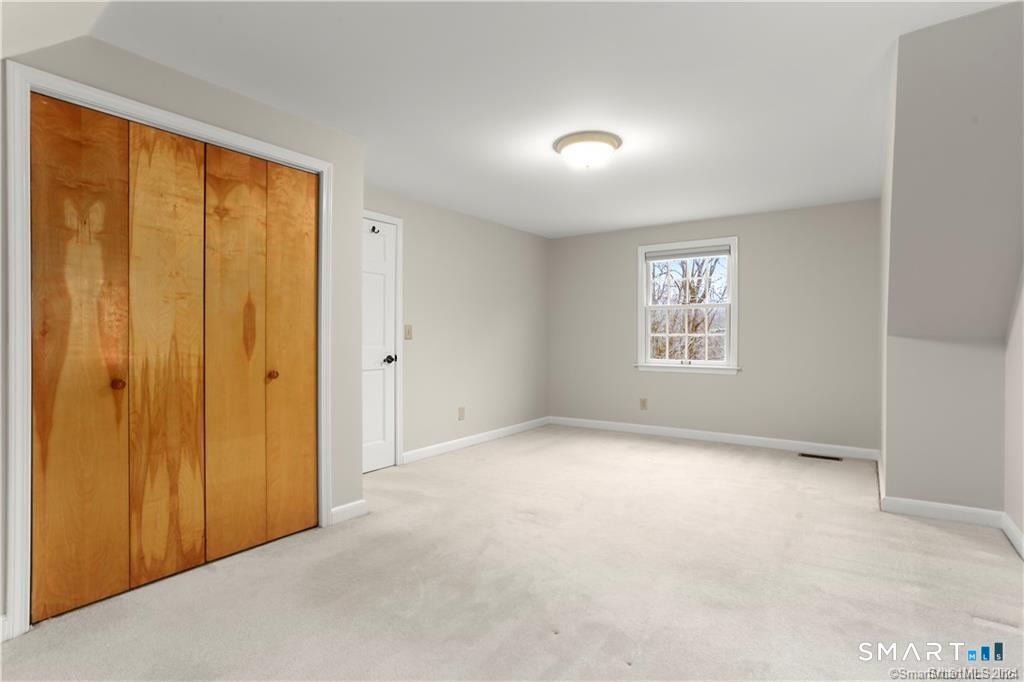 608 Stillson Road Fairfield, CT 06824 - Photo 8 of 16 an empty room with windows