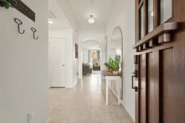a view of a hallway with seating area