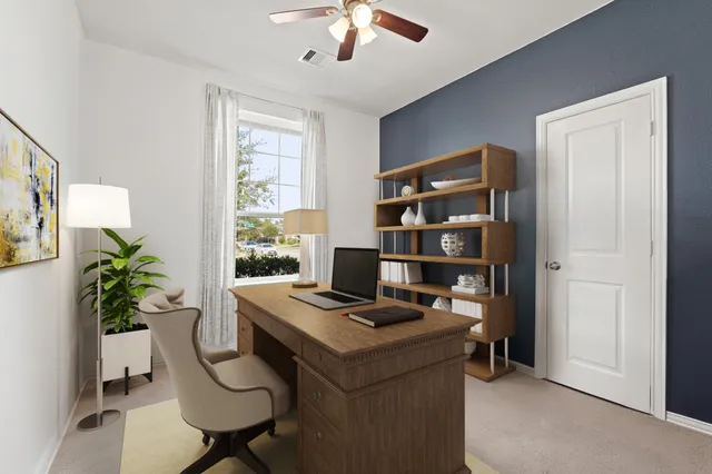 a workspace with furniture and a window
