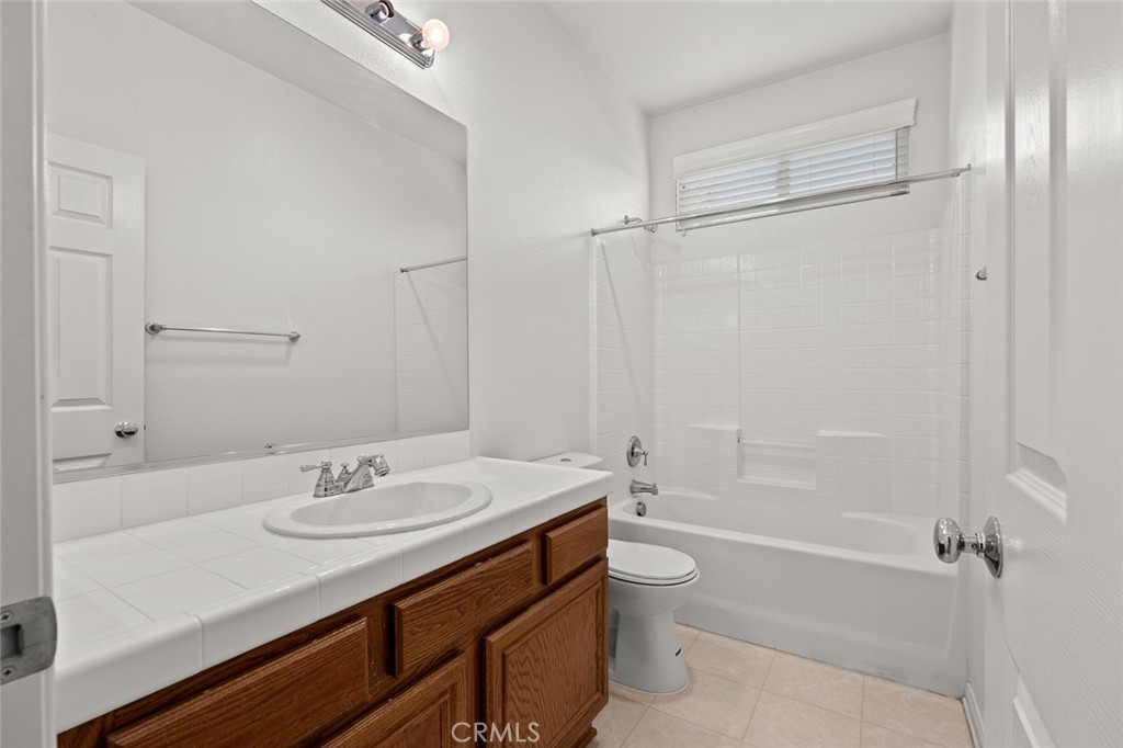 44855 Rutherford Street Temecula, CA 92592 - Photo 19 of 31 a bathroom with a sink a toilet and shower
