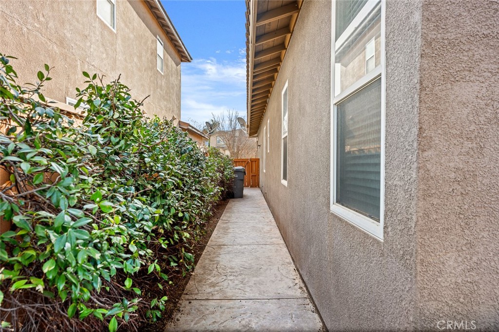 44855 Rutherford Street Temecula, CA 92592 - Photo 25 of 31 a view of a pathway both side of the house