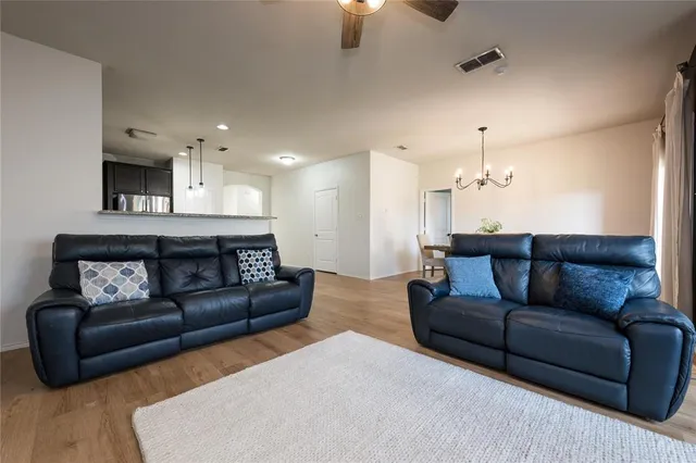 a living room with furniture fireplace and a flat screen tv