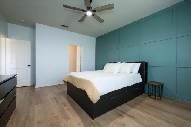 a view of a dining room with furniture wooden floor and chandelier