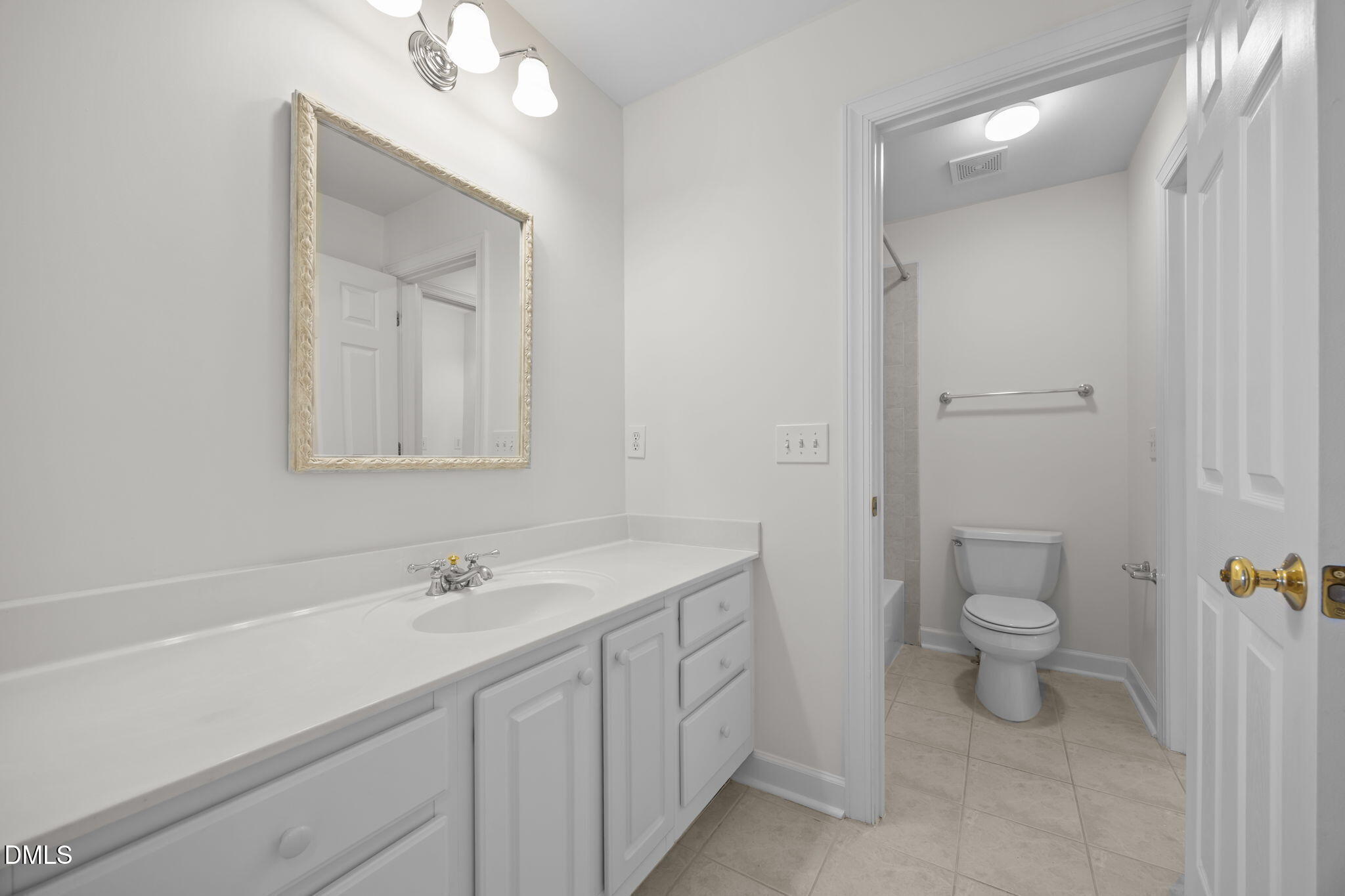 13 Morgans Ridge Lane Durham, NC 27707 - Photo 42 of 53 a bathroom with a double vanity sink toilet and a mirror